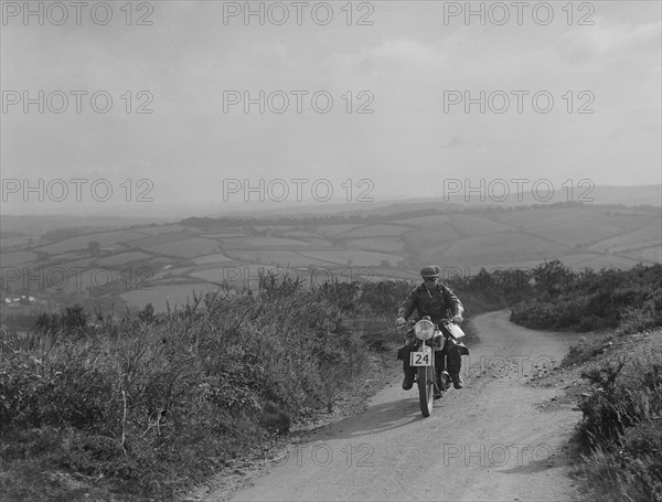 Motorcycle competing in the MCC Torquay Rally, 1938. Artist: Bill Brunell.