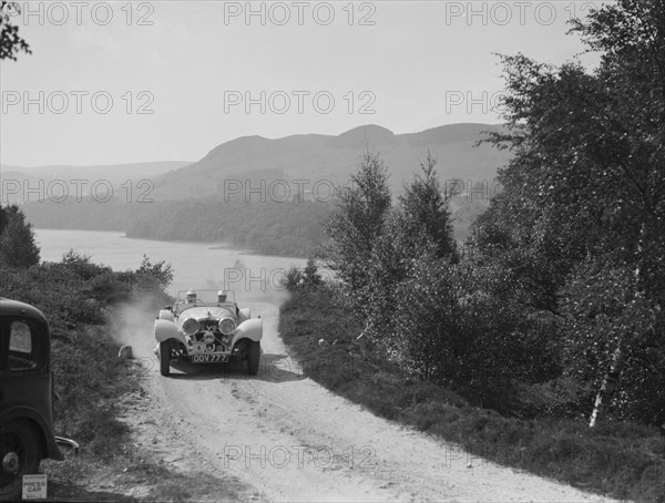 SS Jaguar 100 open 2-seater of Miss E Violet Watson competing in the RSAC Scottish Rally, 1939. Artist: Bill Brunell.