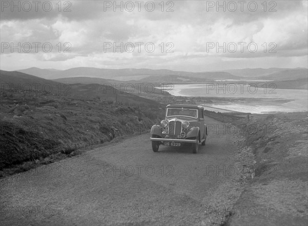 Rover saloon of J Gibbon Jr competing in the RSAC Scottish Rally, 1934. Artist: Bill Brunell.