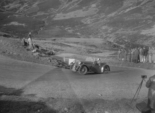 Singer Le Mans 2-seater competing in the RSAC Scottish Rally, Devil's Elbow, Glenshee, 1934. Artist: Bill Brunell.