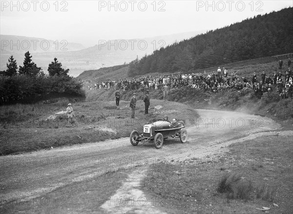 Aston Martin Bunny of Frank B Halford competing in the Caerphilly Hillclimb, Wales, 1923. Artist: Bill Brunell.