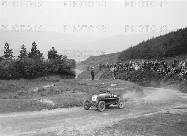 Aston Martin Bunny of Frank B Halford competing in the Caerphilly Hillclimb, Wales, 1923. Artist: Bill Brunell.