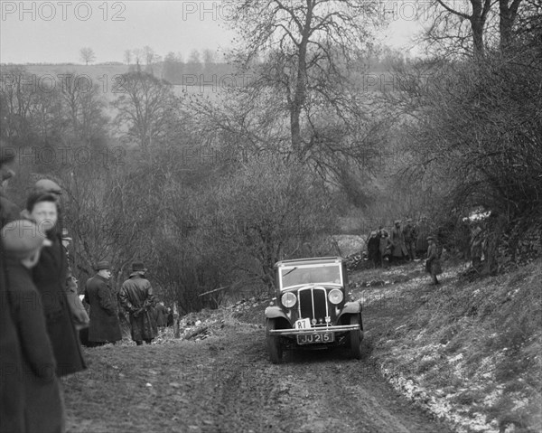 Standard Nine saloon of Mrs M Vaughan competing in the Sunbac Colmore Trial, Gloucestershire, 1933. Artist: Bill Brunell.