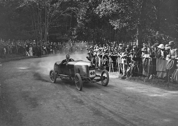 Unidentified open 4-seater competing in the MAC Shelsley Walsh Hillclimb, Worcestershire, 1923. Artist: Bill Brunell.