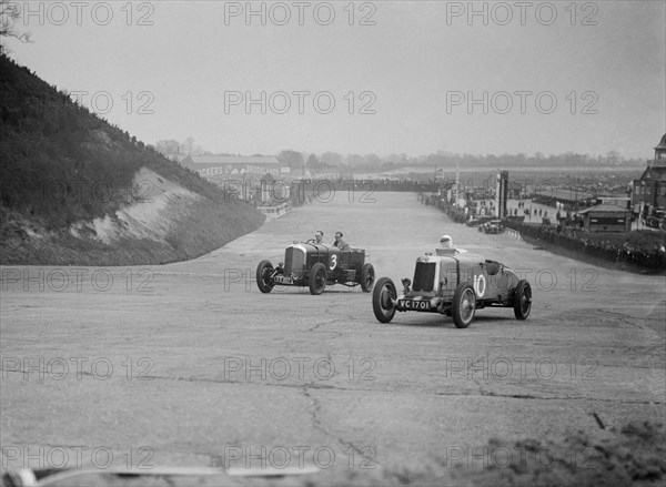 Bentley of Major H Butler and Lea-Francis Hyper racing at a BARC meeting, Brooklands, 1930. Artist: Bill Brunell.