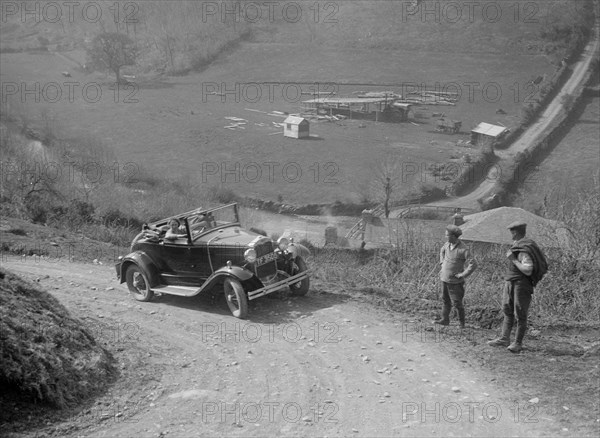 Kitty Brunell driving a 1930 2-seater Ford Model A, 1931.   Artist: Bill Brunell.