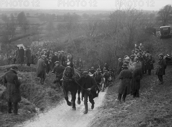 Horse towing a car up Ibberton Hill, Dorset, MCC Exeter Trial, 1930. Artist: Bill Brunell.