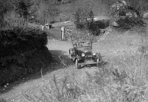 Kitty Brunell driving a 1930 2-seater Ford Model A, 1931. Artist: Bill Brunell.
