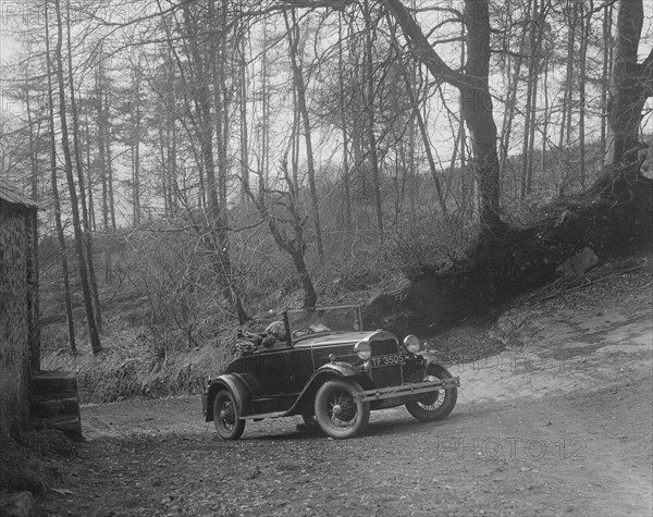 Kitty Brunell driving a 1930 2-seater Ford Model A, 1931. Artist: Bill Brunell.