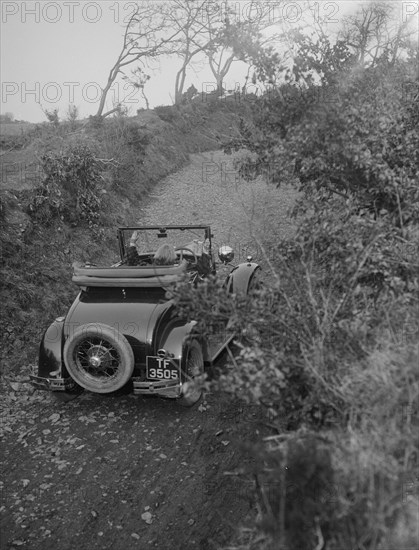 Kitty Brunell driving a 1930 2-seater Ford Model A, 1931.   Artist: Bill Brunell.