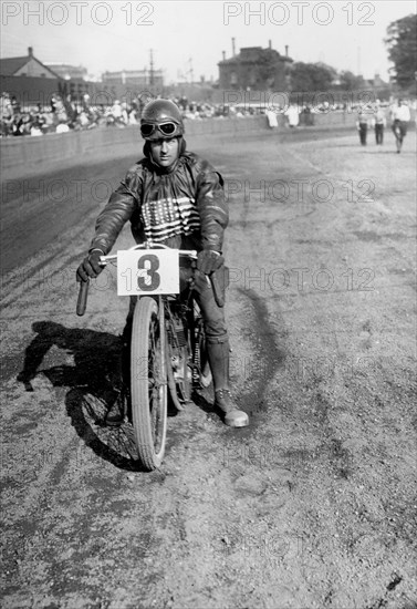 American speedway rider Art Pecha on his Harley-Davidson, Lea Bridge Stadium, Leyton, London, 1928.  Artist: Bill Brunell.