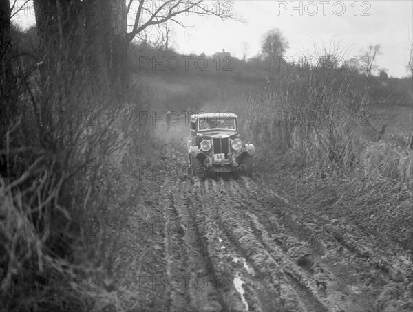 MG 18/80 of N Chichester-Smith competing in the MG Car Club Trial, Kimble Lane, Chilterns, 1931. Artist: Bill Brunell.