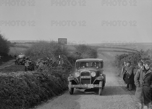 Ford Model A saloon of ASR Payne, MCC Lands End Trial, summit of Beggars Roost, Devon, 1933. Artist: Bill Brunell.