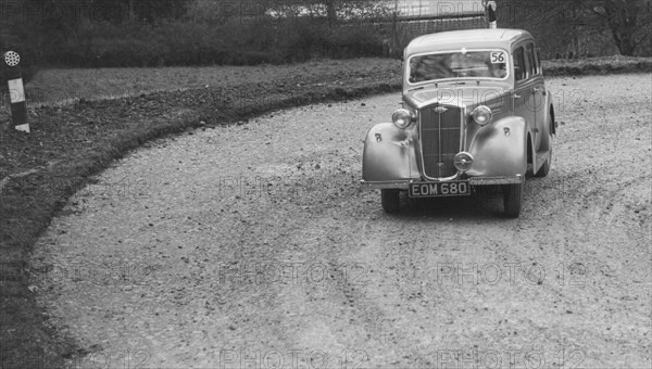 Wolseley saloon of BW Fursdon competing in the RAC Rally, 1939. Artist: Bill Brunell.