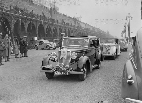 Riley 4-door saloon of AS Bassett at the RAC Rally, Madeira Drive, Brighton, 1939. Artist: Bill Brunell.