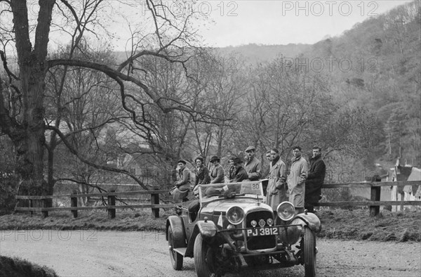 Lagonda 4-seat tourer of CE Littler competing in the RAC Rally, 1939. Artist: Bill Brunell.