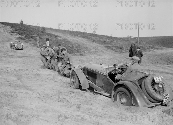 Riley Birdcage Sprite competing in the Great Weat Motor Club Trial, 1938. Artist: Bill Brunell.