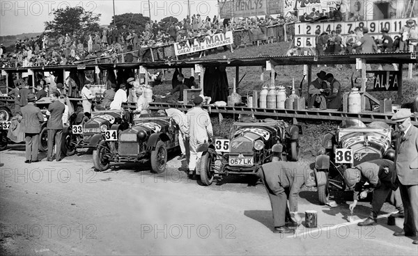 Alfa Romeos in the pits at the RAC TT Race, Ards Circuit, Belfast, 1929 Artist: Bill Brunell.