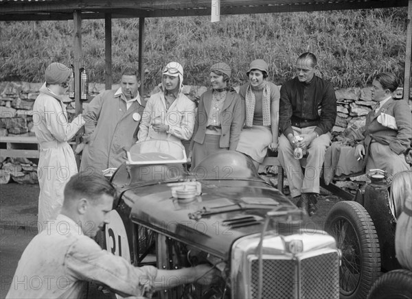 MG C type of Cyril Paul in the pits at the RAC TT Race, Ards Circuit, Belfast, 1932. Artist: Bill Brunell.