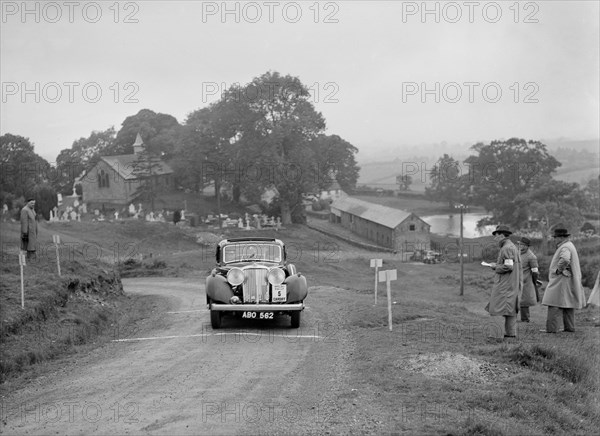 Jaguar SS saloon of SG Davies competing in the South Wales Auto Club Welsh Rally, 1937 Artist: Bill Brunell.