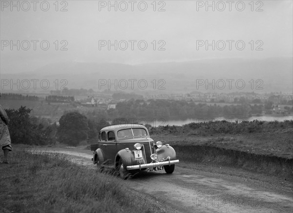 Ford V8 saloon competing in the South Wales Auto Club Welsh Rally, 1937 Artist: Bill Brunell.