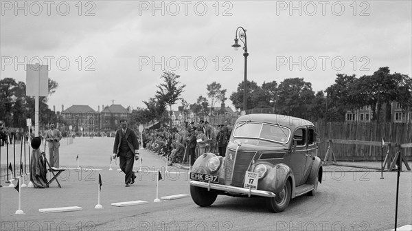 Ford V8 saloon of Viscountess Chetwynd competing in the South Wales Auto Club Welsh Rally, 1937 Artist: Bill Brunell.