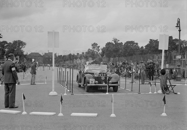 Jensen open 4-seater of Ken Crawford competing in the South Wales Auto Club Welsh Rally, 1937 Artist: Bill Brunell.