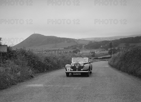 Jensen open 4-seater of Ken Crawford competing in the South Wales Auto Club Welsh Rally, 1937 Artist: Bill Brunell.