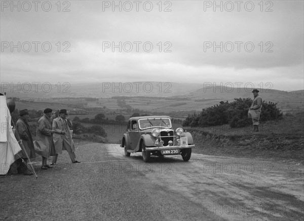Riley Kestrel of A Bassett competing in the South Wales Auto Club Welsh Rally, 1937 Artist: Bill Brunell.