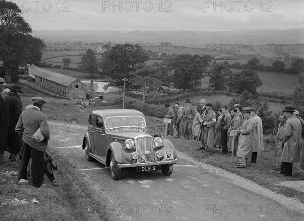 Rover 4-door saloon of FD Cooper competing in the South Wales Auto Club Welsh Rally, 1937 Artist: Bill Brunell.