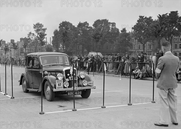 Morris saloon of RK Wellsteed competing in the South Wales Auto Club Welsh Rally, 1937 Artist: Bill Brunell.