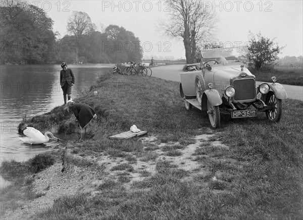 Calcott open tourer by the River Thames at Runnymede, c1922. Artist: Bill Brunell.