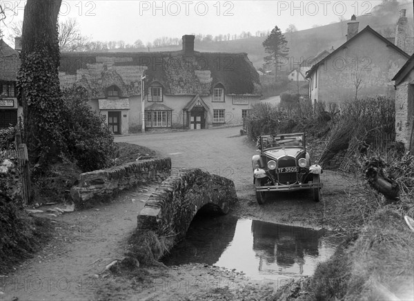 Kitty Brunell driving a Ford Model A 2-seater, Winsford, Somerset, 1930s. Artist: Bill Brunell.