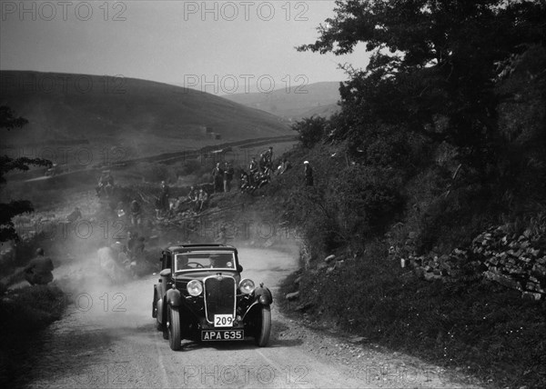 Singer of LA Sandford competing in the MCC Edinburgh Trial, West Stonesdale, Yorkshire Dales, 1933. Artist: Bill Brunell.