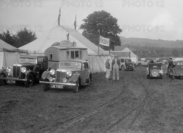 MG SA and MG 18/80 at Shelsley Walsh, Worcestershire, during the Blackpool Rally, 1937.  Artist: Bill Brunell.