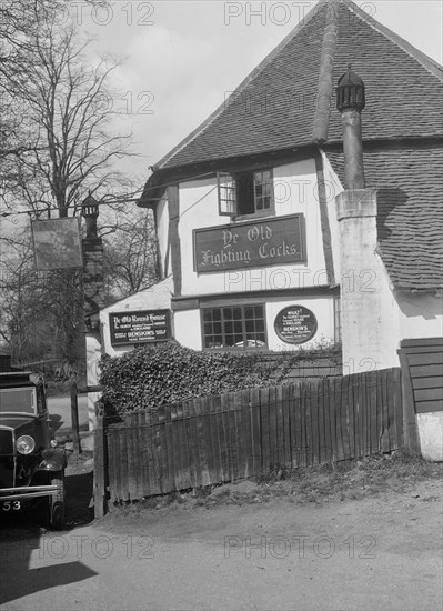 Kitty Brunell's Standard 16 outside Ye Olde Fighting Cocks inn, St Albans, Hertfordshire, 1930s. Artist: Bill Brunell.