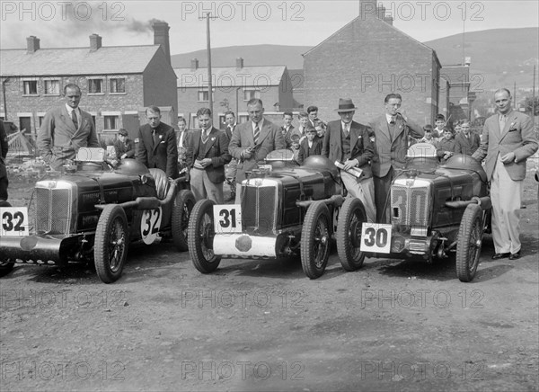 Three MG C type Midgets at the RAC TT Race, Ards Circuit, Belfast, 1932. Artist: Bill Brunell.