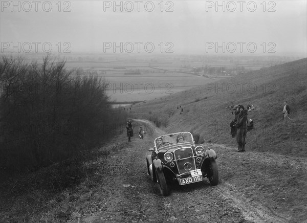 Singer 2-seater sports competing in a trial, Crowell Hill, Chinnor, Oxfordshire, 1930s. Artist: Bill Brunell.