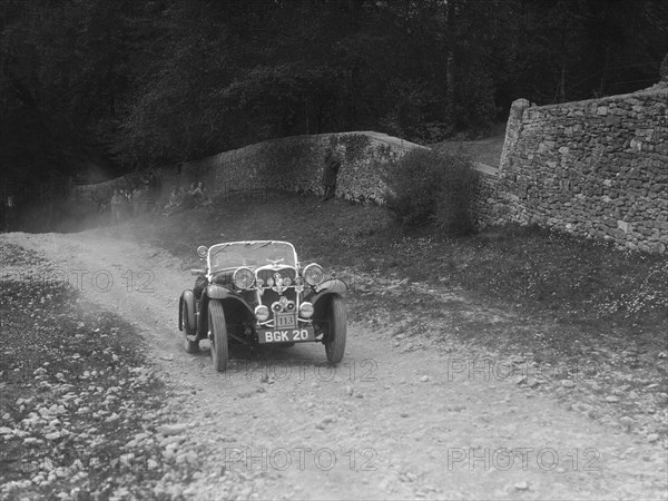 Singer 2-seater sports competing in a motoring trial, Nailsworth Ladder, Gloucestershire, 1930s.. Artist: Bill Brunell.