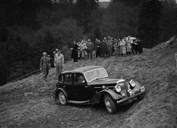 Riley of F Broomfield competing in the MCC Edinburgh Trial, Roxburghshire, Scotland, 1938. Artist: Bill Brunell.