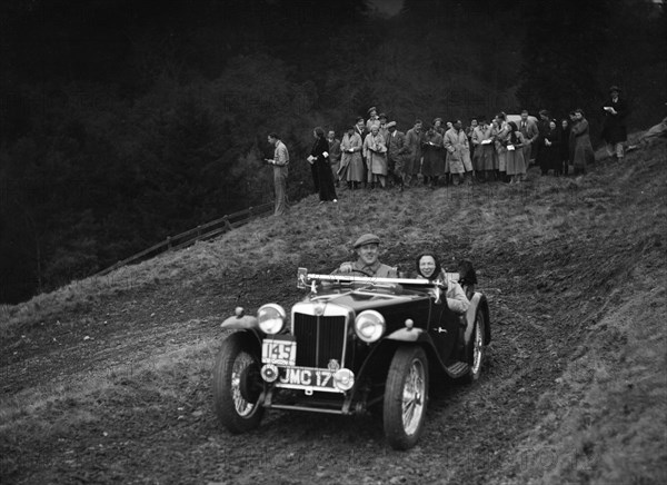 MG TA of H Stevens competing in the MCC Edinburgh Trial, Roxburghshire, Scotland, 1938. Artist: Bill Brunell.