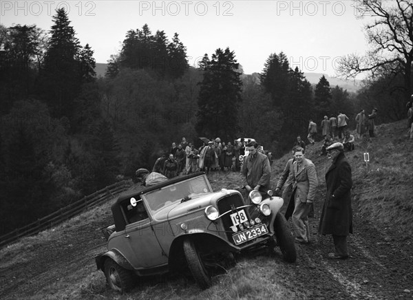 Ford V8 of H Koppenhagen competing in the MCC Edinburgh Trial, Roxburghshire, Scotland, 1938. Artist: Bill Brunell.