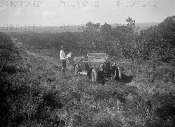 Kitty Brunell road testing a Riley 9 tourer, c1930.  Artist: Bill Brunell.