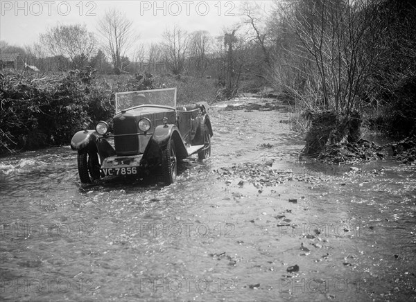 Kitty Brunell road testing a Riley 9 tourer, c1930.  Artist: Bill Brunell.