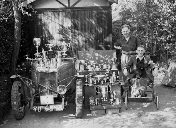 PS Flower with a MG J2 and motoring trophies, 1930s. Artist: Bill Brunell.