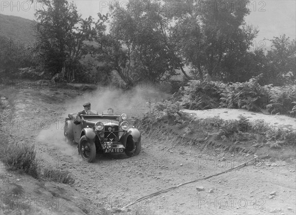 Riley tourer competing in the Barnstaple Trial, c1935. Artist: Bill Brunell.