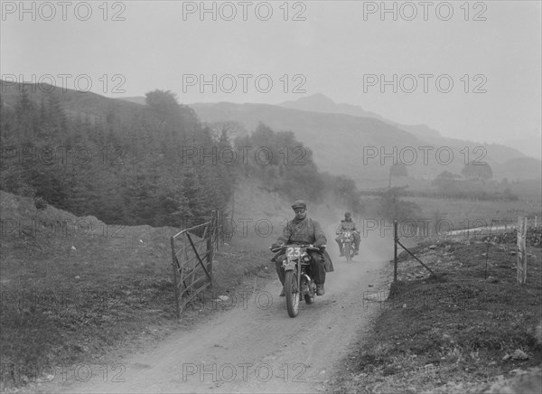 493 cc Triumphs of L Crisp and KP Jones competing in E&DMC Scottish 6 Days Trial, 1933.. Artist: Bill Brunell.