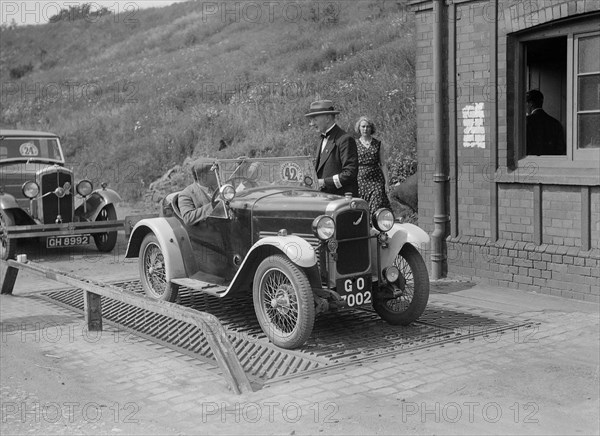 Triumph of J Wallis, winner of the Autocar Cup at the Middlesex County AC Hill Climb, c1930. Artist: Bill Brunell.