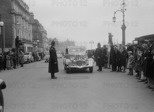 Ford V8 of K Hutchison at the RAC Rally, 1935. Artist: Bill Brunell.