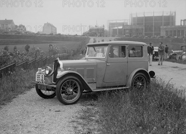 Wolseley Hornet saloon of DEM Douglas-Morris at the B&HMC Brighton Motor Rally, 1930. Artist: Bill Brunell.